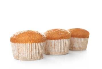 Delicious carrot muffins on white background