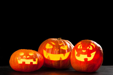 Three halloween Jack O' Lantern pumpkins
