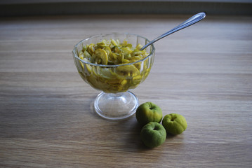 Jam from slices of Chaenomeles japonica (known as Maule's quince) green and yellow fruits in the...