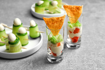 Tasty rolls and appetizers for baby shower party on table