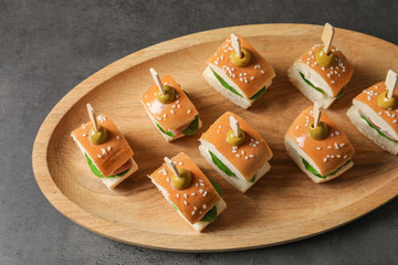 Mini burgers for baby shower party on table