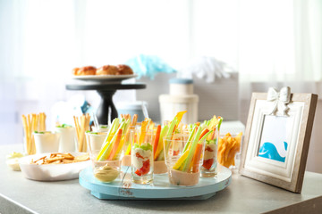 Tasty food for baby shower party on table