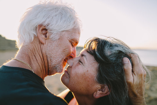 Seniors embracing and kissing
