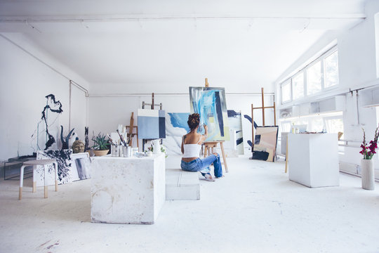 Woman Artist Painting in Her Studio