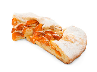 Pieces of tasty apricot cake on white background
