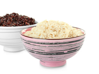 Bowls with brown rice, isolated on white
