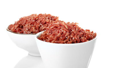 Bowls with red rice, isolated on white