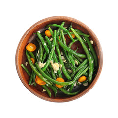Bowl with delicious green beans, almond and carrot slices on white background