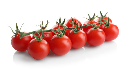 Fresh cherry tomatoes on stem, isolated on white