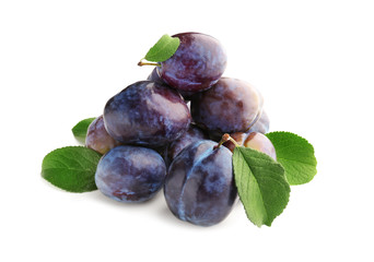 Ripe plums on white background