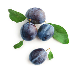 Ripe plums on white background