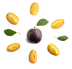Fresh ripe plums on white background