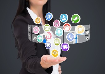 Businesswoman with hand spread of  and application icons coming