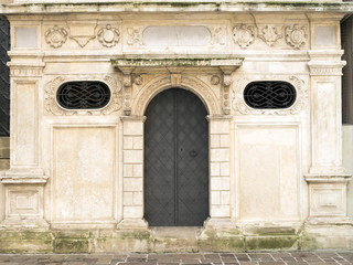 The door, the classic facade of the building with architectural elements