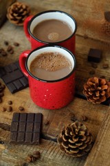 Delicious cocoa and chocolate on wooden table