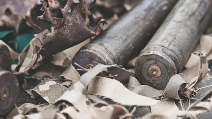 bullet shells from heavy machine gun on the table with camouflage netting