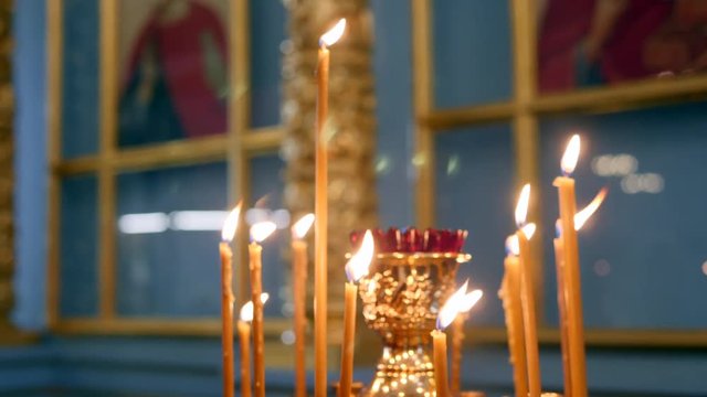 Burning Candles In The Church. 4K, Slow motion.