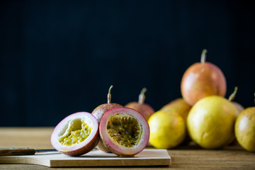 passion fruit on wooden with black background