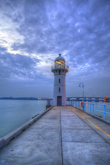 Fototapeta na wymiar Nightfall on Singapore Lighthouse at Tuas