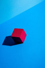 Red cube on blue background