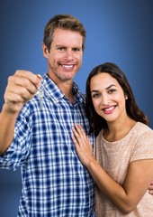 Couple Holding key in front of vignette