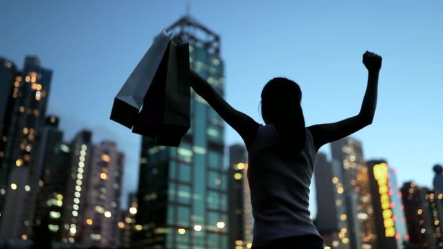 Slow motion of woman holding shopping bag