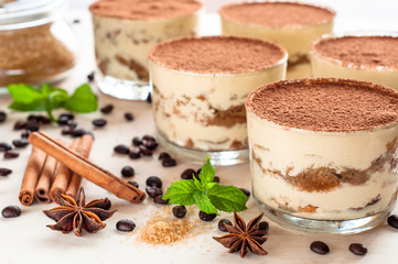 luxurious dessert Tiramisu in a glass with coffee beans