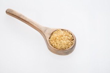 Brown sugar in the wooden spoon