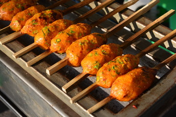 Thai curried fish cake grill on bamboo wood,  selective focus