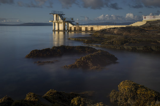 Long exposure of Blackrock diving tower on Salthill during low tide that exposed the seaweed.
