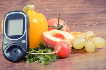 Date 14 November as symbol of world diabetes day, glucometer for measuring sugar level and fruits with vegetables