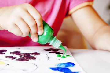 great artist (humorous picture) close up of little baby girl draws a picture paints