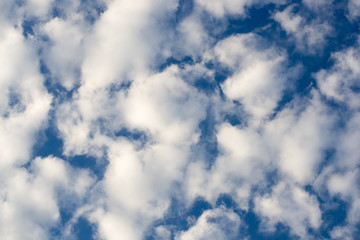 Photo of high blue sky with spindrift clouds background