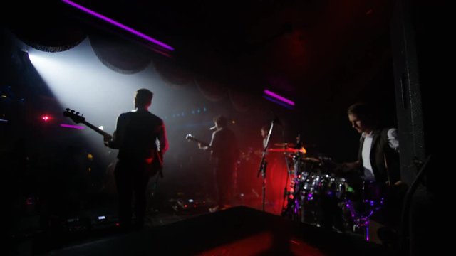  Live band performing in front of an enthusiastic crowd at music event