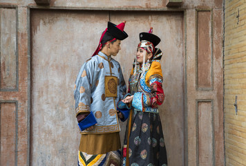 Fototapeta na wymiar mongolian couple in traditional 13th century style outfit