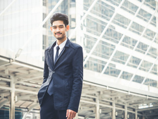 Portrait young asian businessman in modern city