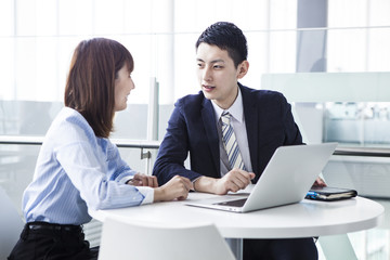 A business couple is making arrangements for work