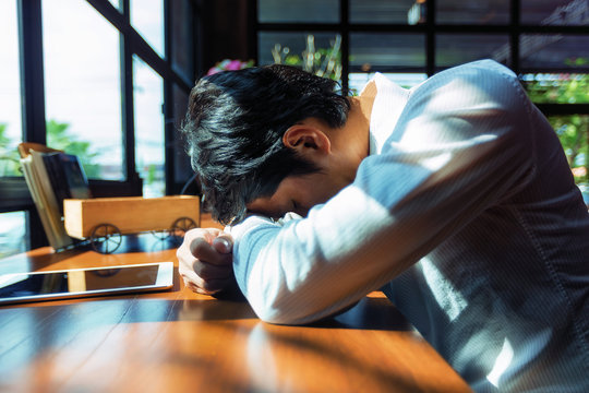 The image of a young businessman slumped down on the table.
