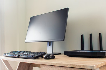 Office table with wifi router and computer and supplies