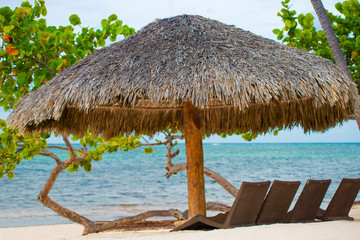 Sun umbrella and beach beds on tropical coastline, Philippines, Boracay