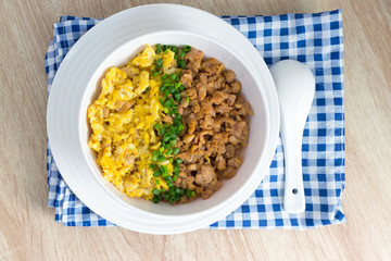 chicken and egg with sauce over rice
