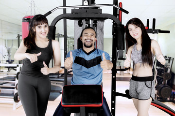 Young friends showing ok sign together