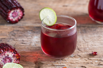 Purple corn juice wood table background