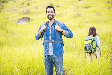 Excited man hiking with his girlfriend