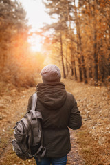 Woman walking in the autumn Park.