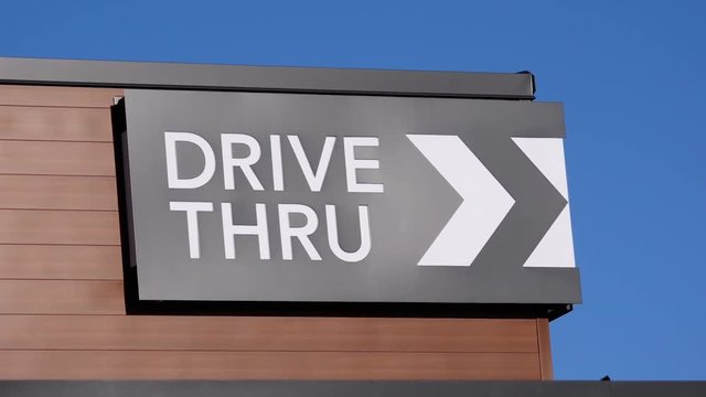 Motion of drive thru on building with blue sky background