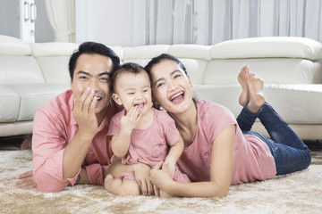 Cute baby having fun with her parents