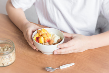 Healthy breakfast bowl in hands