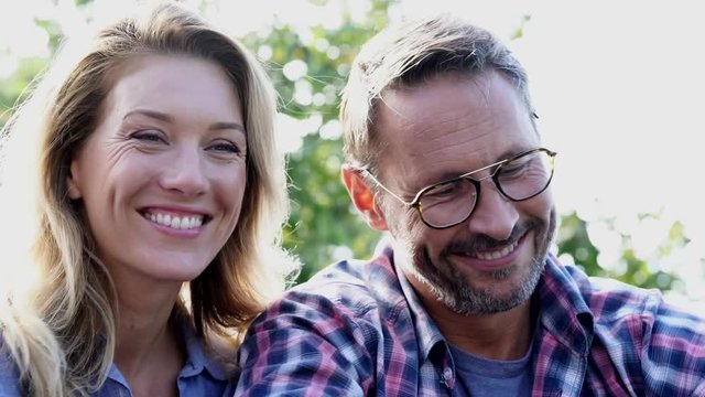 Portrait of cheerful mature couple taking selfie picture