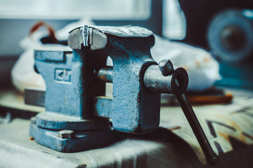 old iron vise on the table